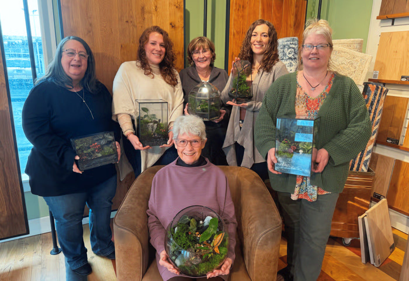 A group building terrariums at an INSIDE workshop